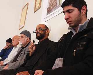 Men attend the funeral of Abdullah Nagi Mahdi at the Islamic Society of Greater Youngstown on Friday, Nov. 21, 2014 at Masjid Al-Khair in Youngstown. Mahdi was killed earlier this week during an attempted robbery at his South Avenue store.