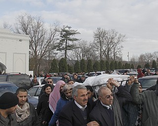 Members of the community attend a prayer service at the funeral of Abdullah Nagi Mahdi at the Islamic Society of Greater Youngstown on Friday, Nov. 21, 2014 at Masjid Al-Khair in Youngstown. Mahdi was killed earlier this week during an attempted robbery at his South Avenue store.