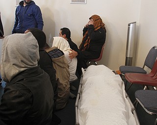 Men turn to pray during the funeral of Abdullah Nagi Mahdi at Masjid Al-Khair where members of the community attended the funeral on Friday, Nov. 21, 2014. Mahdi was killed earlier this week during an attempted robbery at his South Avenue store.