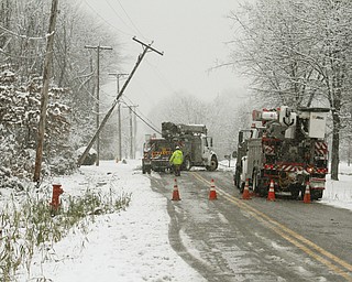       ROBERT K. YOSAY  | THE VINDICATOR...Here comes winter as Ohio Edison Crews on Ohltown Road in Austintown apparetly  cracked do to the weight of the heavy snow on the lines...