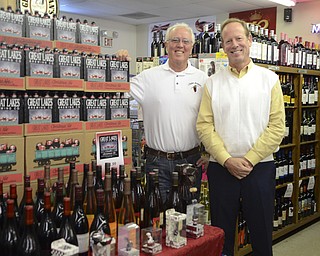 Katie Rickman | The Vindicator.Owners of Chalet Premier in North Lima gear up for the busiest time of year L-R Bill D'Amico and John Potter stand next to their "thanksgiving display" which features different holiday favorites on Wednesday, Nov. 19, 2014.