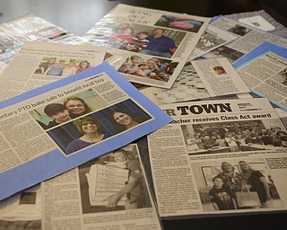 Katie Rickman | The Vindicator.A collection of articles about the benefits that Lisa Weimer has been invovled in over the years on display at her Poland home on Wednesday, Nov. 19, 2014.