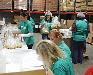        ROBERT K. YOSAY  | THE VINDICATOR..Charter OneÕs annual Carving Out Hunger program, now in its 10th year, and a Charter One Foundation $10,000 grant will once again help the Second Harvest Food Bank of the Mahoning Valley launch its holiday season.