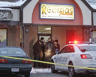        ROBERT K. YOSAY  | THE VINDICATOR.. A police spokesman said a store owner and the man who tried to rob the store exchanged gunfire and both were hit late this afternoon. according to Brad Blackburn - the shooting is under investigation. and Conditions were not known...