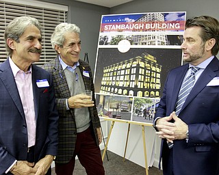William D Lewis the Vindicator   Brothers and developers James, left, and George Pantelidas and Dominic J. Marchionda of NYO Property Group during a event in youngstown 11-19-14. Plans for a Hotel Youngstown in the Stambaugh Building were announced.