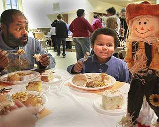 William D Lewis The Vindicator Billy Odem of Youngstown and his son Billy Odem Jr. 5, enjoy a turkey dinner at Lockwood United Methodist Church in Boardman 11-19-14. The church sponsors a free community dinner every other month.