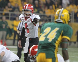 Youngstown State quarterback Hunter Wells (6) calls an audible at the line of scrimmage during the first quarter of Saturday afternoons matchup against North Dakota State University at the Fargodome in North Dakota.  Dustin Livesay  |  The Vindicator  11/22/14  Fargo, North Dakota.
