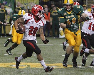 Youngstown State's Jody Webb (20) outruns North Dakota State's Nick DeLuca (49) to the corner during the second quarter of Saturday afternoons matchup at the Fargodome in North Dakota.  Dustin Livesay  |  The Vindicator  11/22/14  Fargo, North Dakota.