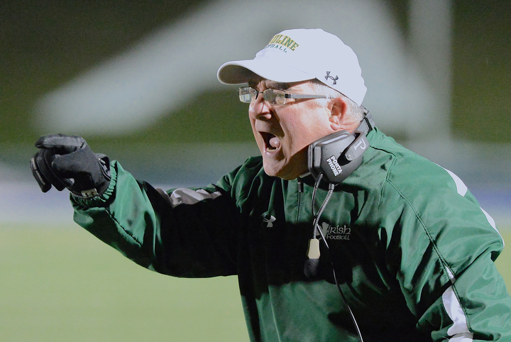 Jeff Lange | The Vindicator  Fighting Irish head coach Larry Kempe reacts to his team's poor performance on the field during regional finals action in Uniontown, Saturday night. The Canton Crusaders ousted Ursuline from the competition in a 20-6 victory.