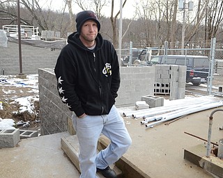 Katie Rickman | The Vindicator. Tom Wolfgang of Lowellville stands near the Influent Grit Removal system at the Waste Water Treatment Building in Lowellville on Thursday, Nov. 20, 2014. The construction has temporarily been stopped due to the cold weather.