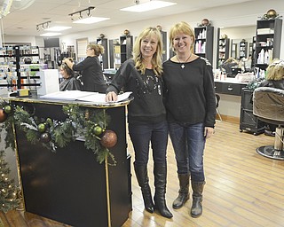 Katie Rickman | The Vindicaor.Co-Owners of Special Touch salon in Poland Village Andrea Naples (left) and Anne Holecko pose for a photo in their business on Thursday, Nov. 20, 2014.