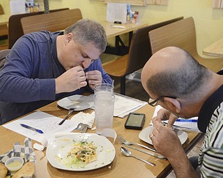 Katie Rickman | The Vindicator.Mike Vallas and Mark Smesko of Brothers in Food chow down on Mahi Mahi Tacos at Calle Doce in Campbell on Saturday, Nov. 22, 2014.