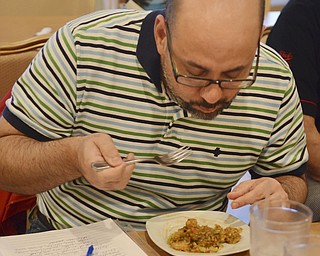 Katie Rickman | The Vindicator.Mark Smesko enjoys food at Calle Doce in Campbell on Saturday, Nov. 22, 2014.