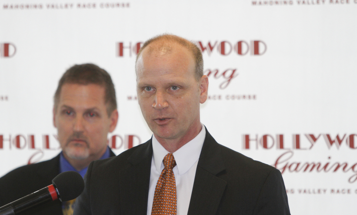        ROBERT K. YOSAY  | THE VINDICATOR..Windy but warm temperatures had the Hollywood Gaming Racino parking lot filled as people came out to watch the inagural run of thoroghbred racing in the Mahoning Valley...Mike Galle GM