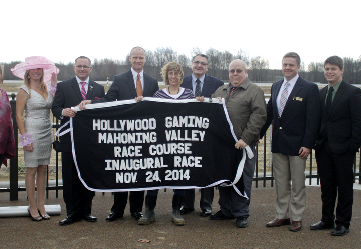        ROBERT K. YOSAY  | THE VINDICATOR..Windy but warm temperatures had the Hollywood Gaming Racino parking lot filled as people came out to watch the inagural run of thoroghbred racing in the Mahoning Valley...THe blanket won by the first horse presentation