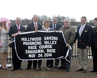        ROBERT K. YOSAY  | THE VINDICATOR..Windy but warm temperatures had the Hollywood Gaming Racino parking lot filled as people came out to watch the inagural run of thoroghbred racing in the Mahoning Valley...THe blanket won by the first horse presentation