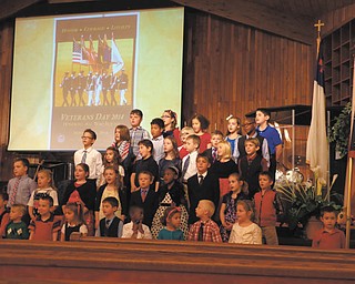 SPECIAL TO THE VINDICATOR — Victory Christian School, 2053 Pleasant Valley Road, Niles, recently opened its doors to all veterans and their guests for a special brunch and program with guest speaker Burton Kephart, Vietnam veteran and author of “Proven in Battle.” Guest Timothy McCall sang “It’s Always Been the Soldier.” Above, the elementary students sing during the program.