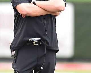 Youngstown State football coach Eric Wolford watches third-quarter action during the Penguins’ game against Duquesne at Stambaugh Stadium. On Monday, the university fired Wolford after five years as the Penguins head coach.