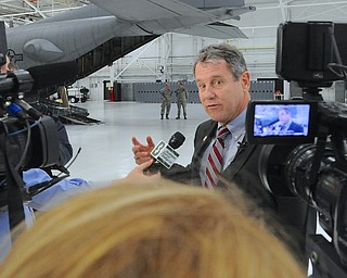 Jeff Lange | The Vindicator  Senator Sherrod Brown speaks to press about future intentions of upgrading the air base's C-130 Hercules airplanes by the year 2020, Monday morning in Vienna.