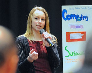 Jeff Lange | The Vindicator  Kinsey Warren, 8th grader at Struthers Middle School explains to the judges how her group's restaurant will be environmentally friendly during Struthers Middle School's "Wildcat Cage" a spinoff of the TV show Shark Tank, Monday afternoon.