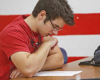        ROBERT K. YOSAY  | THE VINDICATOR.. Canfield HS students meet for 30 minutes before school to attain extra credit....  . some students take extra classes as Todd Muckleroy teaches psychology.. Aaron Bernard.. looks over a quiz..