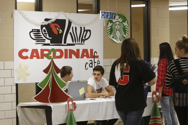        ROBERT K. YOSAY  | THE VINDICATOR.. Canfield HS students meet for 30 minutes before school to attain extra credit....  .cardinal cafe as Anthony Vross sophmore and Nick Phillips a junior monitor the desk and orders .