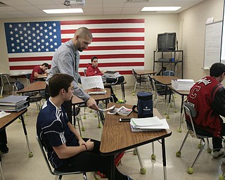        ROBERT K. YOSAY  | THE VINDICATOR.. Canfield HS students meet for 30 minutes before school to attain extra credit....  . some students take extra classes as Todd Muckleroy teaches psychology..  as he passes out a test to Christian Hume