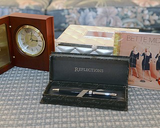 Katie Rickman | The Vindicator.Gifts given to Diana Colaianni sit on her living room table on Tuesday, Nov. 25, 2014. After 19 years as the Director of Nursing at MC Health Department, she is retiring.