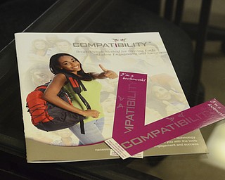 Katie Rickman | The Vindicator.Bookmarks and a flyer for Compatibility  Tuesday, Nov. 25, 2014. Compatibility is a considered the non-romantic match system that connects people with like people (ie. roommates)