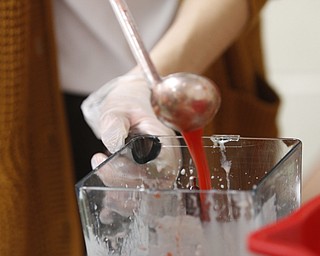        ROBERT K. YOSAY  | THE VINDICATOR.. Canfield HS students meet for 30 minutes before school to attain extra credit....  at the Cardinal Cafe enterprise ..Smoothies  ingredients are made fresh on site