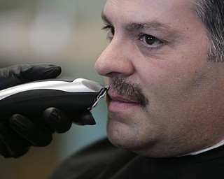        ROBERT K. YOSAY  | THE VINDICATOR..Mike Case- WFMJ morning show...  gets his moustache taken off by Jamie Decembly.. Mercy Health Youngstown, formerly Humility of Mary Health Partners, Man Up Mahoning Valley, Mercy Health Youngstown Cancer Centers, Mercy Health Foundation, NEO Urology and Partners for Urology Health will close out ÔMovemberÕ with an official shave-off at