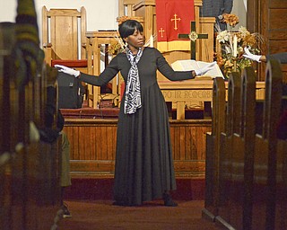 Katie Rickman | The Vindicator. Minister Valeria Johnson of Youngstown dances with the Visual ARts Ministry dance group at Greater Friendship Baptist Church in Youngstown for the Thanksgiving service on Wed. Nov. 26, 2014.