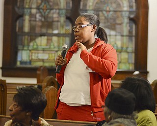 Katie Rickman | The Vindicator.Tanika Dickens of Youngstown gives a testimony of thanks to God for many things including her "miracle daughter"  at Greater Friendship Baptist Church in Youngstown for the Thanksgiving service on Wed. Nov. 26, 2014.