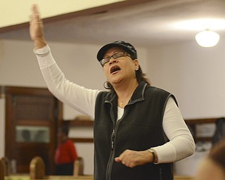 Katie Rickman | The Vindicator.Sherry Thomas of Youngstown worships  at Greater Friendship Baptist Church in Youngstown for the Thanksgiving service on Wed. Nov. 26, 2014.