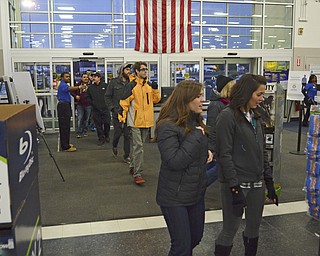 Katie Rickman | The Vindicator.After waiting in a line for hours, customers walk through the doors at 5pm when Best Buy began their Thanksgiving Day sale on Thursday, Nov. 27, 2014 in Boardman.