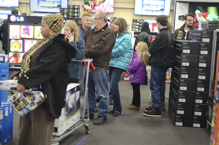 Katie Rickman | The Vindicator.A line forms near the entertainment section of Best Buy with customers who waited in  a long line for hours to be first in line for the Thanksgiving Day specials on Thursday, Nov. 27, 2014.