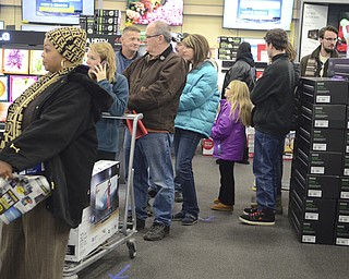 Katie Rickman | The Vindicator.A line forms near the entertainment section of Best Buy with customers who waited in  a long line for hours to be first in line for the Thanksgiving Day specials on Thursday, Nov. 27, 2014.