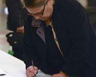 Katie Rickman | The Vindicator.Sandra Sacui of Campbell writes well-wishes to the Trafficant family after the tribute for Traficant at the Deyore Performing Arts Center on Sunday, Nov. 2014 Youngstown, Ohio. Sacui says that Traficant "will be remembered for all the good he did" and adds that he will be greatly missed.