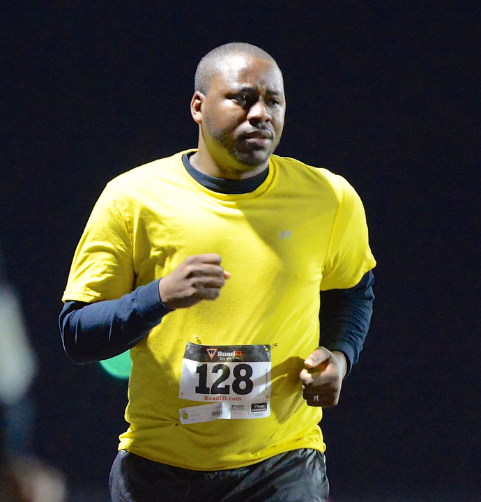 Jeff Lange | The Vindicator  Brian Hughes of Youngstown makes his way to the finish line as he participates in the 1 mile race Sunday evening as part of the 1st Austintown Polar Run.