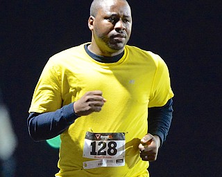 Jeff Lange | The Vindicator  Brian Hughes of Youngstown makes his way to the finish line as he participates in the 1 mile race Sunday evening as part of the 1st Austintown Polar Run.