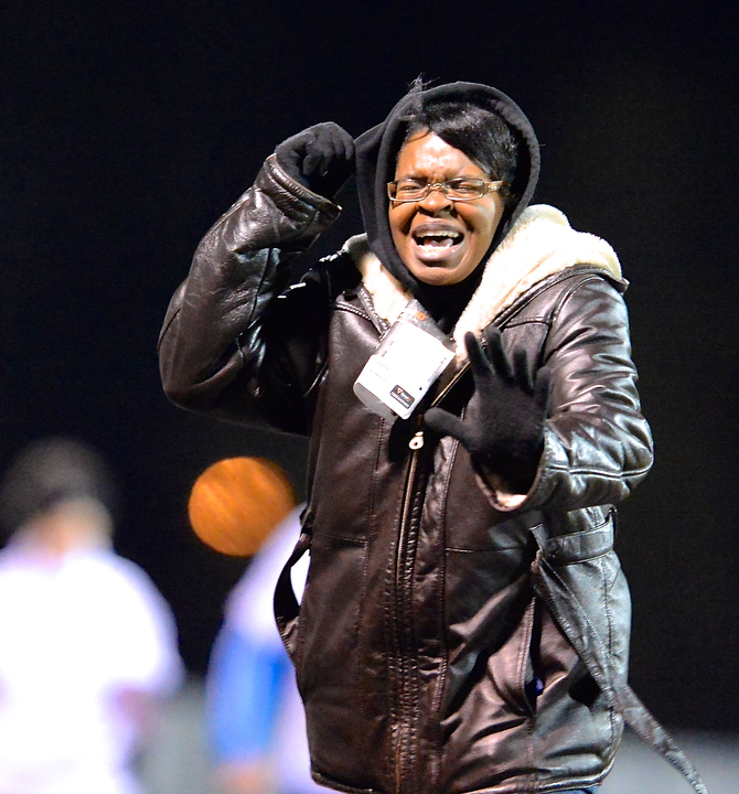 Jeff Lange | The Vindicator  Candace Bryant of Youngstown pulls her hood up as she braves the winds during the 2 mile walk of the Polar Run, Sunday evening at Austintown Fitch High School.