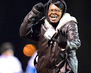 Jeff Lange | The Vindicator  Candace Bryant of Youngstown pulls her hood up as she braves the winds during the 2 mile walk of the Polar Run, Sunday evening at Austintown Fitch High School.