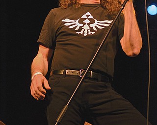 Paul Skowron, lead singer of White Noise, performs Sunday during the Youngstown Music Awards at Rodeo Music Hall in Austintown. The band performed several songs in honor of their drummer and friend Allen Sillaman, who recently died. Sillaman also won “Greatest Drummer” during the ceremony.
