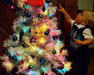 Logan Cheney of Hubbard is looking at his decorated tree. Sent by his mom, Amanda Liston