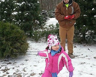 "I'll get it Daddy," says Sophia to her daddy, Joshua Barringer, "just cut the tree down." Sent  by Nana Barb Barringer.