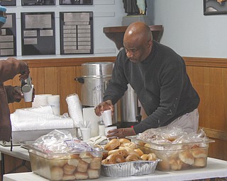        ROBERT K. YOSAY  | THE VINDICATOR..Getting the coffee ready is Al Abrams --The Webster family again spent the Friday after Thanksgivng  at the Rescue Mission preparing food as their Patriarch and Matriarch of our family, Donald and Louise Webster (both deceased.) They were long time residents of Youngstown ..-30-