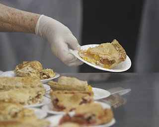        ROBERT K. YOSAY  | THE VINDICATOR..What dinner wouldnt be right without apple pie..The Webster family again spent the Friday after Thanksgivng  at the Rescue Mission preparing food as their Patriarch and Matriarch of our family, Donald and Louise Webster (both deceased.) They were long time residents of Youngstown ..-30-