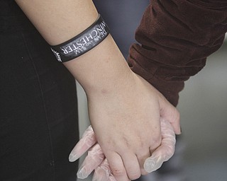        ROBERT K. YOSAY  | THE VINDICATOR..Fellowship and helping out.. as the ( webster clan)  grasps hands in a circle and prays before serving dinner at the Rescue Mission..The Webster family again spent the Friday after Thanksgivng  at the Rescue Mission preparing food as their Patriarch and Matriarch of our family, Donald and Louise Webster (both deceased.) They were long time residents of Youngstown ..-30-