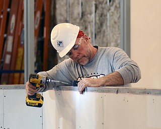 Katie Rickman | The Vindicator.Kirk Miller of Negley, Ohio works at the new Warren Center which is an extension of Eastern Gateway Community College on Tuesday, Dec. 2, 2014.