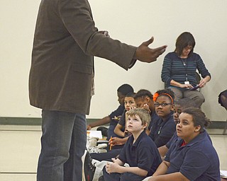 Katie Rickman | The Vindicator.Former NBA player Michael Morrison speaks to a group of students during a special assembly at Stambaugh Charter Academy on Tuesday, Dec. 2, 2014. Morrison told them about his childhood and childhood hardships.